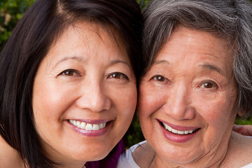 Mature Asian mother and her adult daughter.