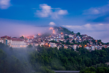 Beautiful stunning view over the old town of Veliko Tarnovo on a foggy summer morning in Bulgaria.
