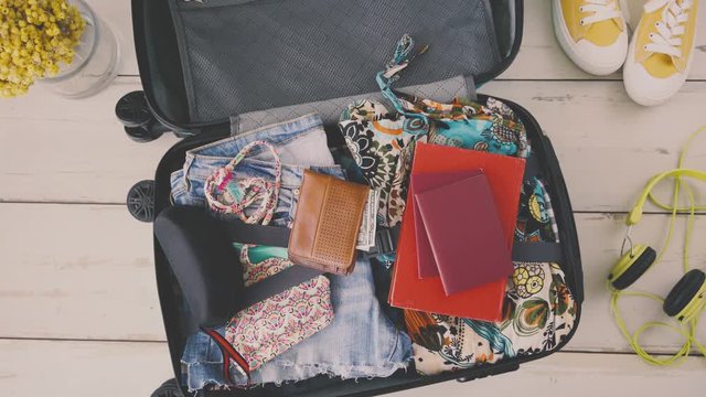 Travel suitcase preparing concept