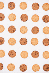 Cookies background. Chocolate chips biscuits texture background. Fattening sweets concept