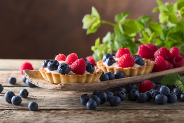 Closeup of fancy gourmet fresh berry dessert tarts.