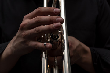 Hand of the Trumpeter on the buttons of trumpet