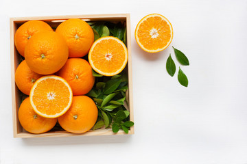 Fresh orange citrus fruit with leaves isolated on white backgrou