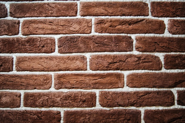brown brick wall with white seams