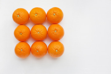Fresh orange citrus fruit on white background.