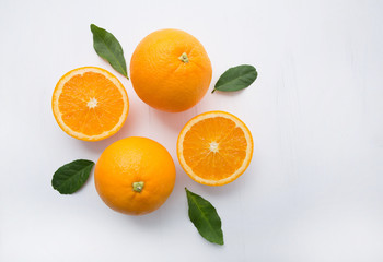 Fresh orange citrus fruit on wooden white background. Top view