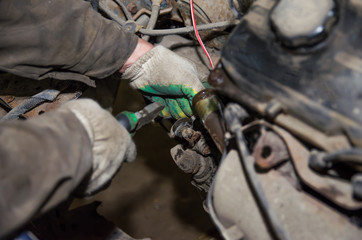 a man is repairing a car