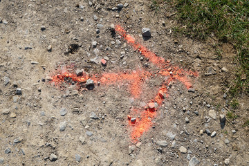Painted arrow on the ground showing to the right.