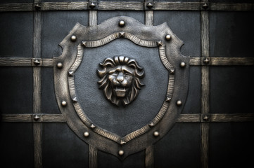 decorative processing of a metal fence in the form of a lion on a shield