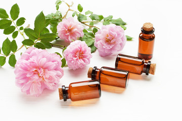 Bottles of essential rose oil for aromatherapy.