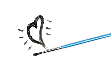 Spilled black watercolor sketching and blue paintbrush isolated on white background, top view