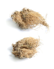 Dried medicinal herbs raw materials isolated on white. Root of Polemonium caeruleum