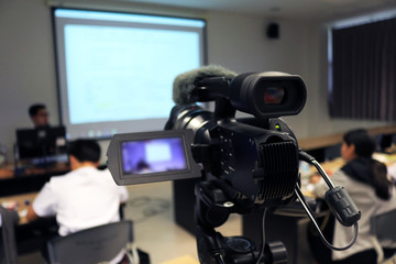 Photographer recording  video lecturer and student learning in classroom of university. - Education...