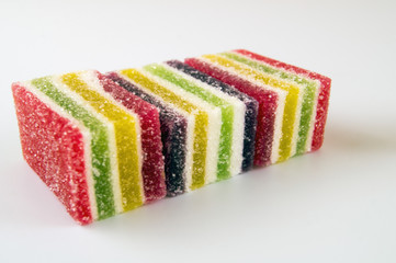 Multicolored marmalade, strewn with sugar