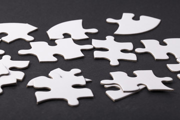 blank white puzzle pieces, last piece
