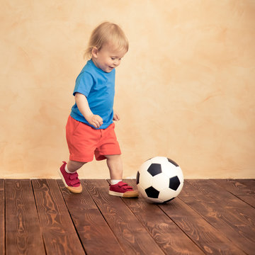 Child is pretending to be a soccer player