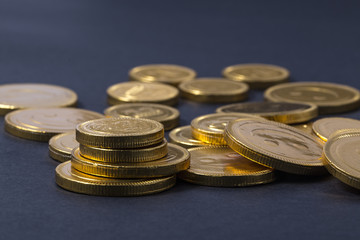 chocolate coin gold on black background.