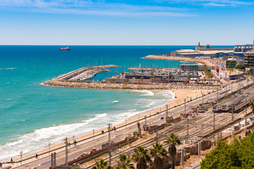 Naklejka premium TARRAGONA, SPAIN – MAY 1, 2017: Port and railway station in Tarragona, Catalunya, Spain. Copy space for text.