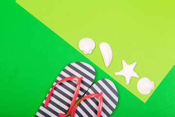 Beach flip flop on color background