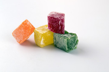 Slices of sweets. Lukum green, red, orange and yellow