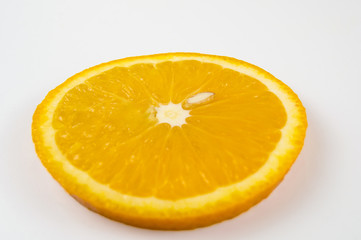 A slice of orange orange on a light background