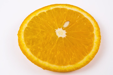 A piece of ripe orange orange on a light background