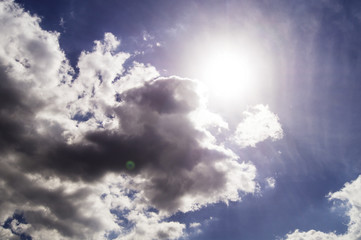 Naklejka na ściany i meble Heavenly surface with sun and clouds
