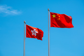 Hong Kong And Chinese Flag With Blue Sky