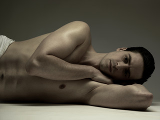 portrait of a man lying on his side