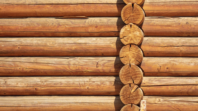 Logs on the wall with a log frame as a background