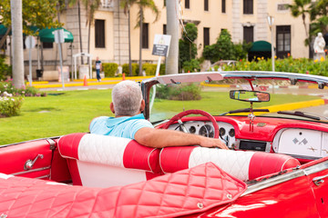 CUBA, HAVANA - MAY 5, 2017: American red retro cabriolet on city street. Сlose-up.