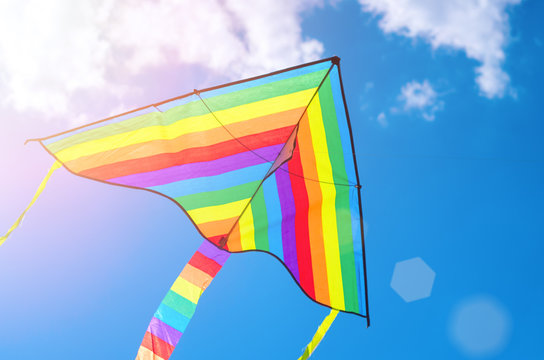 colorful flying kite game flying in the sky, sunlight