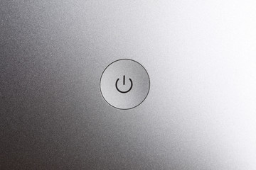 close up on a computer power bottom with copy space
