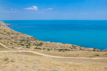 Roads and sea landscape at Cape Meganom, the east coast of the peninsula of Crimea. Colorful background, travelling concept.