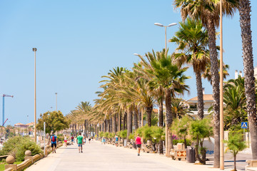Naklejka premium SITGES, CATALUNYA, SPAIN - JUNE 20, 2017: View of the embankment. Copy space for text.