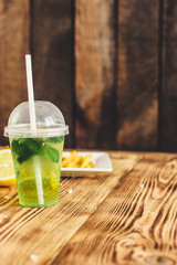 fresh mint lemonade - cold drink (a plastic glass of drink) - mojito