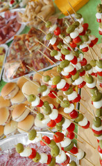 skewers with olives, mozzarella cheese of bufala, mortadella and