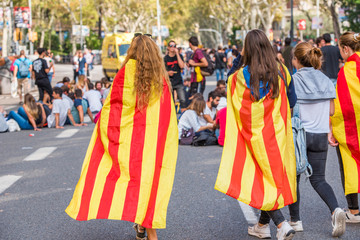 BARCELONA, SPAIN - OCTOBER 3, 2017: Demonstrators bearing catalan flags during protests for independence in Barcelona. Close-up.