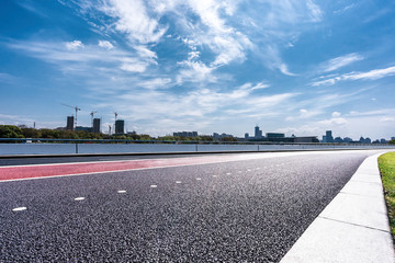 city skyline with asphalt road