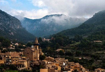Fototapeta na wymiar Small mediterranean village among mountains in Mallorca, Spain.