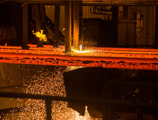 Cutting metal with oxygen. High temperature. Hot metal close up. Steel production