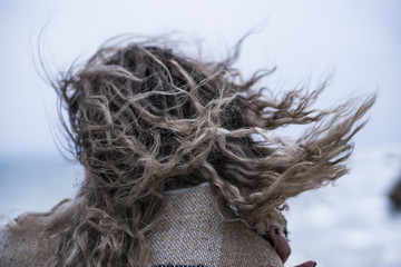 Moody Young Woman in Red Dress Have Fun at the Sea Coast Cliff