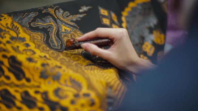 Batik Tulis, Closeup Canting and batik painting on the fabric Indonesia