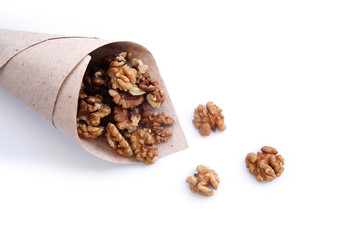 A paper texture package filled with peeled walnuts