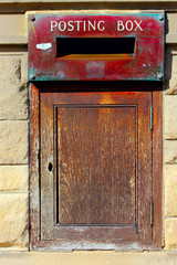 vintage posting box on the wall in england