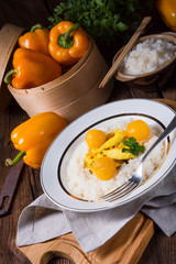 Chicken strips with rice and sweet mirabelle in curry sauce