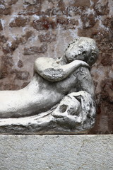 Fototapeta na wymiar Ancient marble fountain in Urbino, Italy
