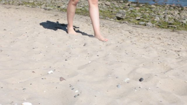 feet walking at the beach