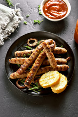 Fried sausage in frying pan