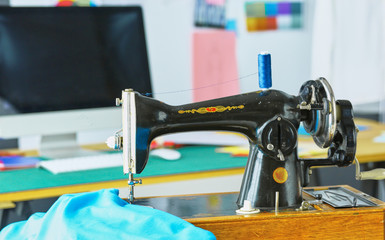 Empty workroom and workplace of tailor or vendor of clothes in small boutique